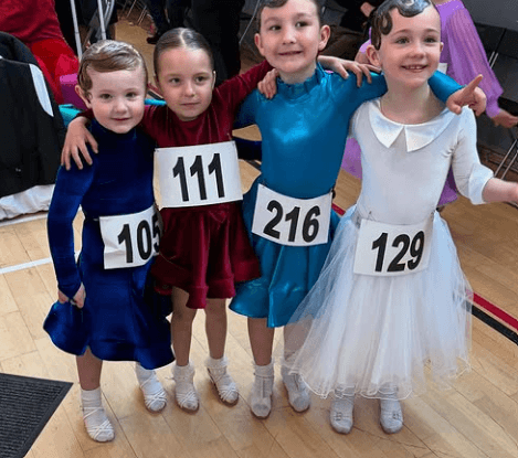 Young competition dancers with number bibs