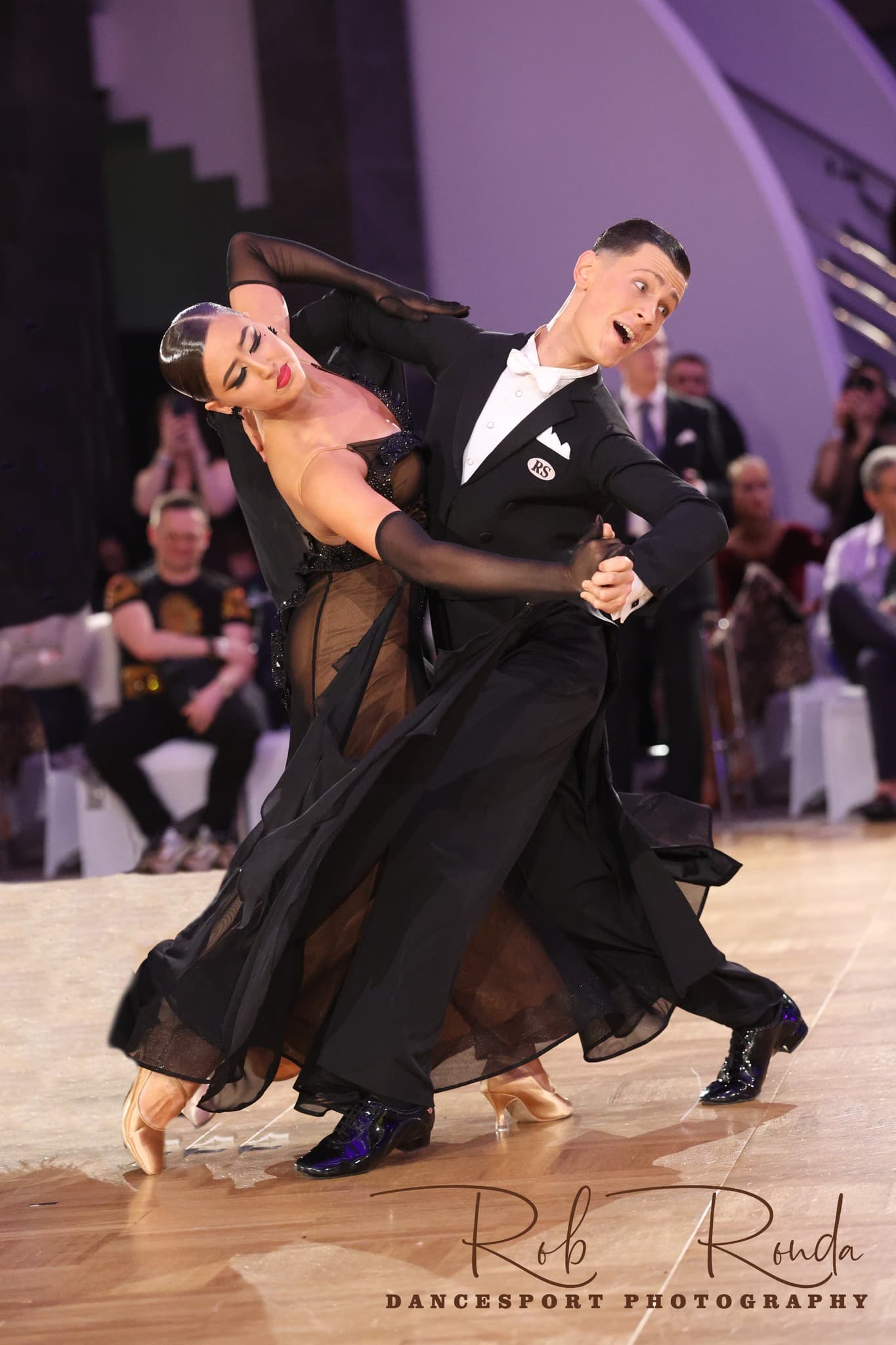 Ballroom couple in formal competition hold